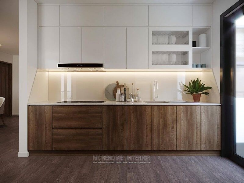 Tủ bếp được làm từ nhựa acrylic tone màu trắng, có kiểu dáng kịch trần và có nhiều ngăn để tạo ra khu vực chứa đồ lớn cho căn bếp.
